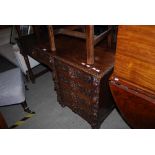 LATE 19TH CENTURY STAINED OAK KNEEHOLE DESK WITH SINGLE FRIEZE DRAWER, FLANKED BY BANK OF FOUR