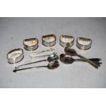 SET OF FOUR SILVER NAPKIN RINGS, ANOTHER OVAL SHAPED SILVER NAPKIN RING AND ASSORTED SILVER