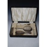 CASED FOUR PIECE PART SILVER DRESSING TABLE SET, COMPRISING MIRROR, TWO BRUSHES, SHOE HORN