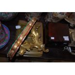 A CARVED GILT WOOD BRACKET WITH PAINTED FAUX MARBLE TOP, TOGETHER WITH A LEATHER PAPER TRAY COVER