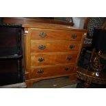 SMALL SATINWOOD GEORGE III STYLE CHEST OF FOUR LONG GRADUATED COCKBEADED DRAWERS ON BRACKET FEET