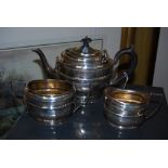 AN EDWARD VII THREE PIECE BACHELORS SILVER TEA SET, BIRMINGHAM 1902, MAKERS MARK OF W D, OVAL SHAPED