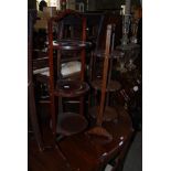 A MAHOGANY THREE TIER FOLDING CAKE STAND TOGETHER WITH ANOTHER COPPER AND BRASS INLAID EASTERN STYLE