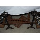 ARTS AND CRAFTS STYLE CAST IRON FIRE BASKET ON TAPERED SQUARE SECTION AND IRONS WITH DISHED TOPS AND