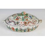 A Chinese porcelain famille rose covered warming tureen, Qing Dynasty, the oval shaped base