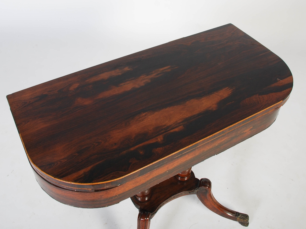 An early 19th century rosewood, boxwood lined and gilt metal pedestal games table, the hinged D- - Image 2 of 7