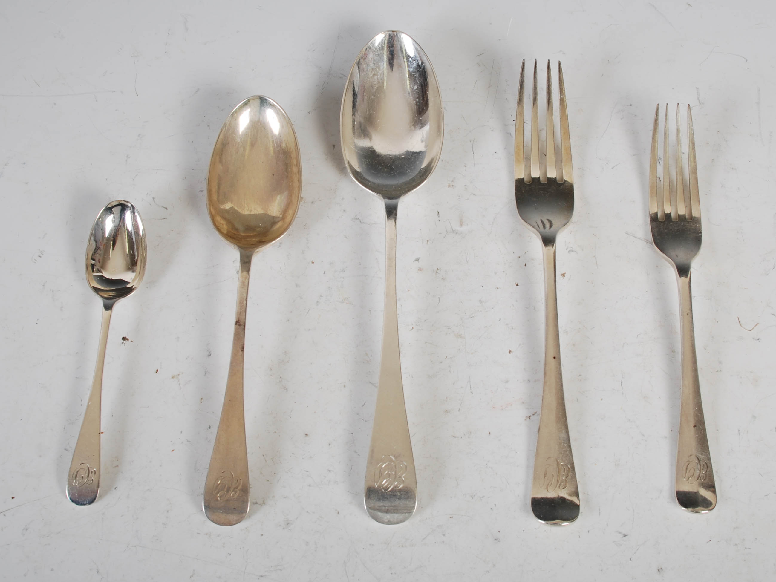 A suite of silver flatware, Sheffield, 1929, makers mark of C.J over A, Hanoverian pattern, engraved