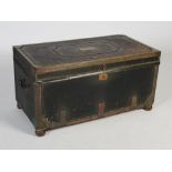 A George III leather and brass studded trunk/ chest, the hinged rectangular top centred with