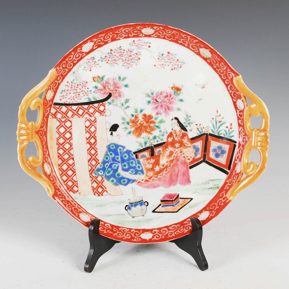 A Japanese Imari twin handled circular tray, late 19th/ early 20th century, decorated with fenced