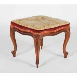 A late 19th century rosewood dressing table stool, the square foliate upholstered seat raised on