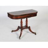 An early 19th century rosewood, boxwood lined and gilt metal pedestal games table, the hinged D-