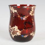 A late 19th century Bohemian ruby glass tumbler, with enamelled decoration of floral garlands and