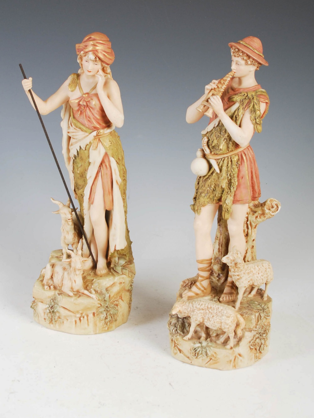 A pair of Royal Dux figure groups, male shepherd and female goat herder, applied and impressed
