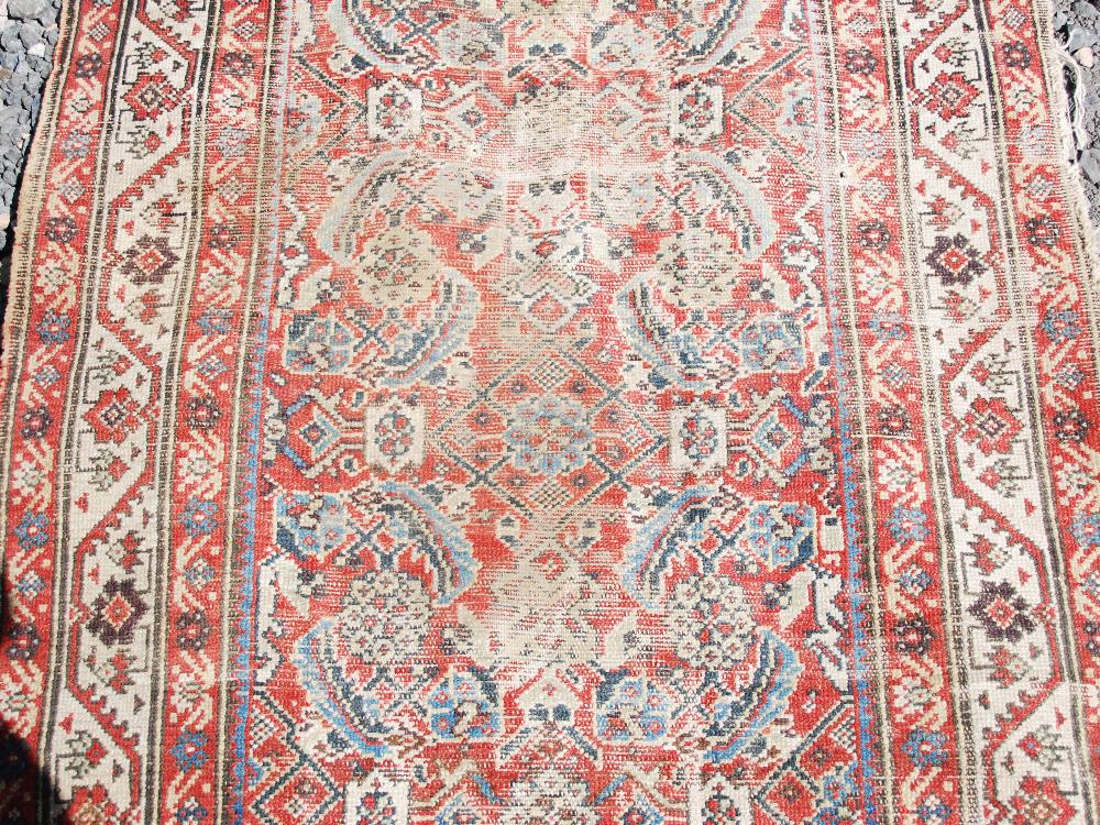 A Persian long rug and a Persian runner, the long rug with a blue rectangular field of stylised - Image 3 of 10