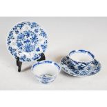 A pair of Chinese porcelain blue and white tea bowls and saucers, Qing Dynasty, decorated with