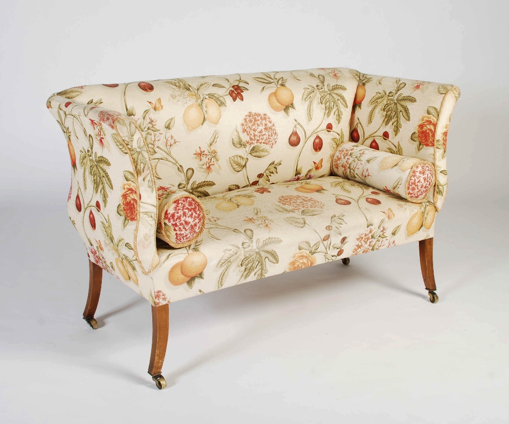 A late 19th/ early 20th century mahogany sofa in Regency style, the later fruit and flower