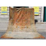 An Ushak carpet, late 19th century, the salmon pink coloured rectangular field decorated with