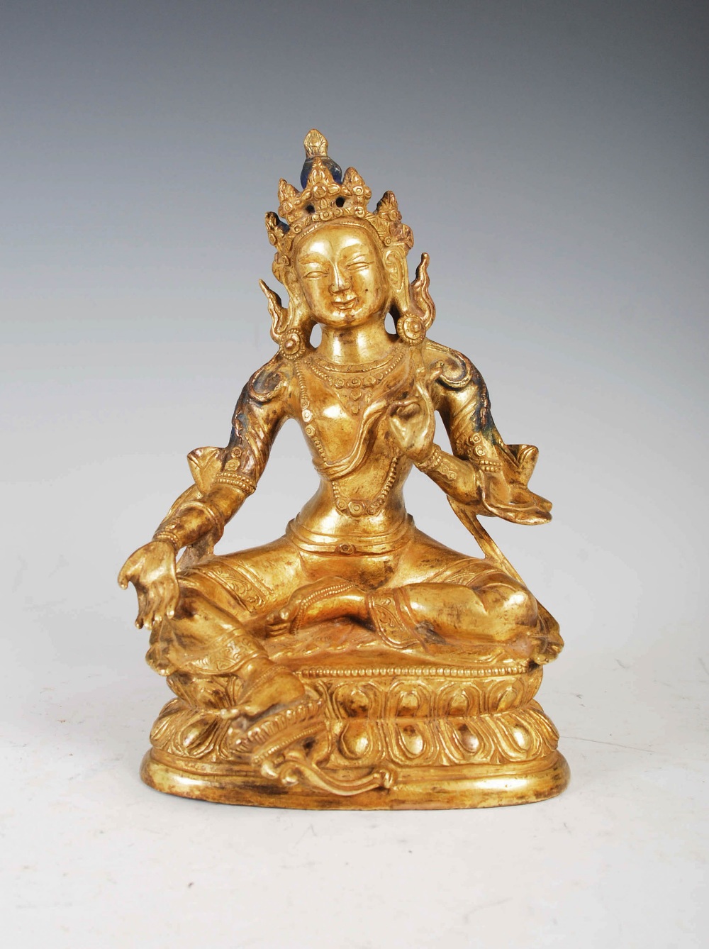 A Chinese gilt bronze figure of Buddha, Qing Dynasty, 16.5cm high.