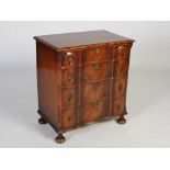 An early 20th century walnut chest of drawers in the Queen Anne style, the rectangular top with