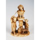 A Japanese ivory okimono of monkey lantern lighter, boy and dog, Meiji Period, signed, 8cm high.