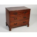 A 19th century mahogany chest, the rectangular top with moulded edge over pull-out brush slide and