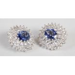 A pair of white metal synthetic sapphire and yttrium aluminium garnet cluster clip earrings, 20th