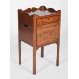 A 19th century mahogany bedside locker in George III style, the rectangular top with shaped three