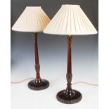 A pair of George III style mahogany table lamps, 20th century, with pleated tapered conical