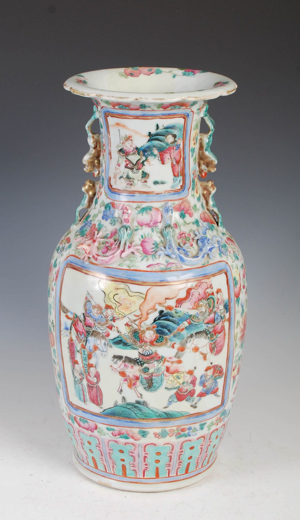 A Chinese porcelain famille rose vase, Qing Dynasty, decorated with rectangular shaped panels of