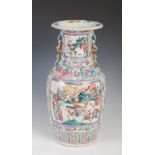 A Chinese porcelain famille rose vase, Qing Dynasty, decorated with rectangular shaped panels of
