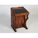 A 19th century rosewood Davenport, the rectangular top with three-quarter gallery above a hinged