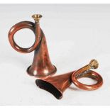 Two copper and brass bugle shaped hunting horns, 14.5cm long and 14cm long.