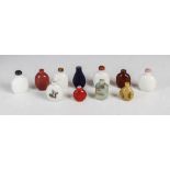 A collection of eleven Chinese glass snuff bottles, Qing Dynasty, to include; an opaque white bottle