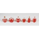 A collection of six Chinese red glass overlay snuff bottles, Qing Dynasty and later, to include; a