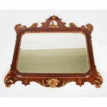 An early 20th century mahogany and parcel gilt overmantle mirror in George III style, 128cm wide x