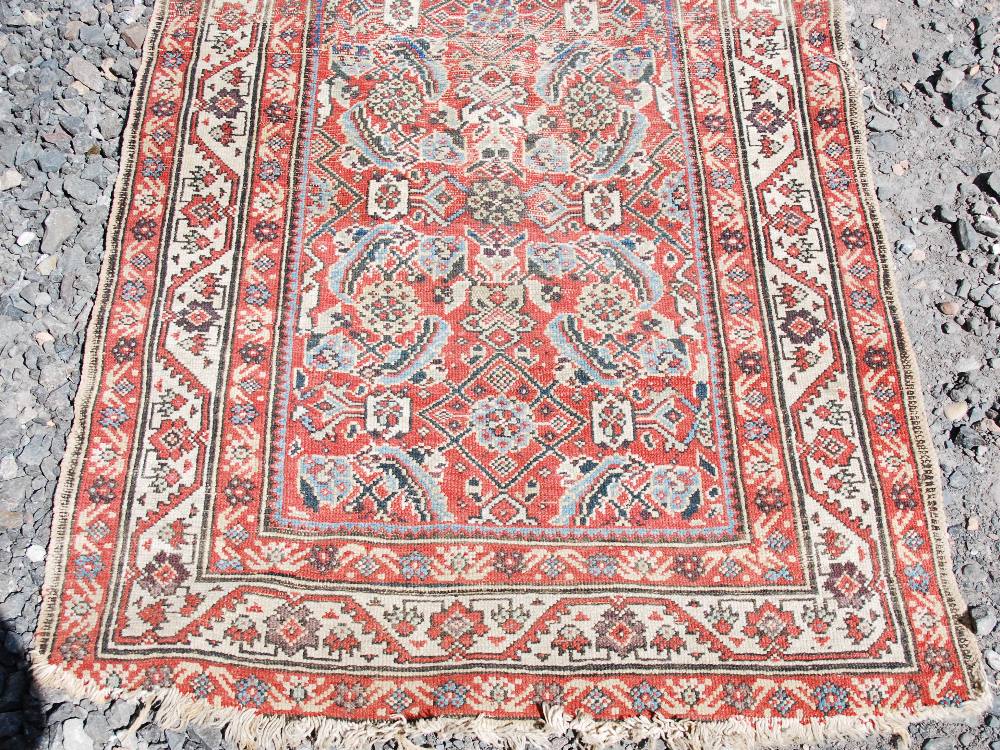 A Persian long rug and a Persian runner, the long rug with a blue rectangular field of stylised - Image 2 of 10