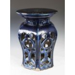 A Chinese porcelain cobalt blue glazed garden seat, Qing Dynasty, hexagonal shaped with circular