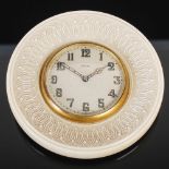 An early 20th century ivory desk clock, the Swiss-made eight day clock with silvered Arabic