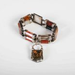 A 19th century Scottish white metal mounted polished agate bracelet, formed from three square panels