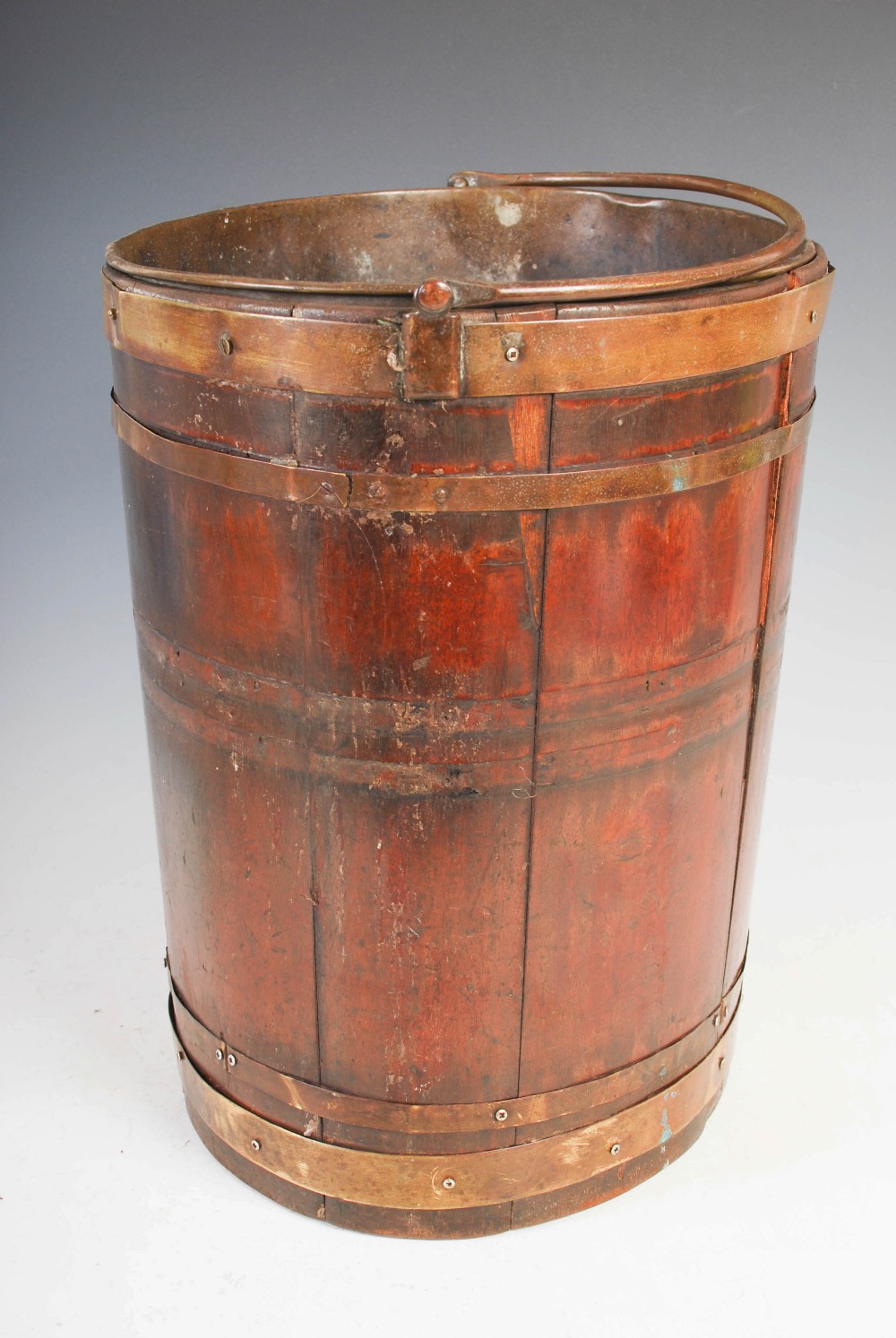 A 19th century mahogany and brass bound oval pail, with hinged carry handle, 34cm high x 34cm wide. - Image 5 of 5