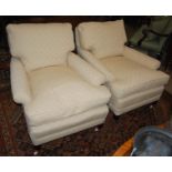 A pair of armchairs in the style of Howard & Sons, recent manufacture