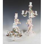 A pair of Sitzendorf porcelain flower encrusted four light candelabra, the columns formed as
