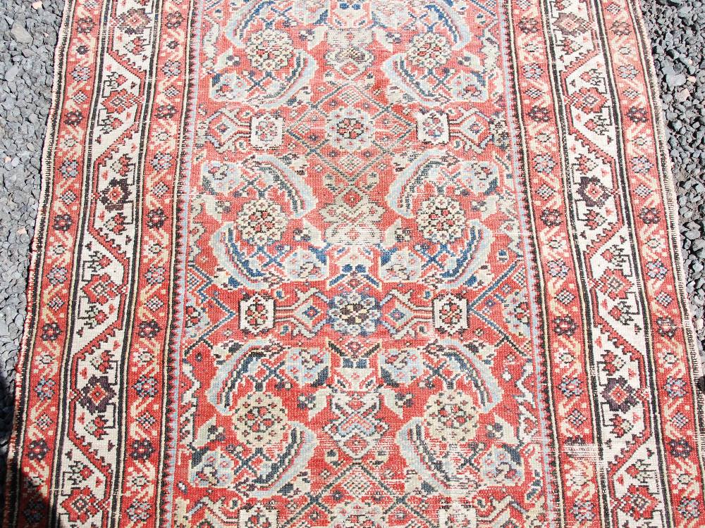 A Persian long rug and a Persian runner, the long rug with a blue rectangular field of stylised - Image 4 of 10