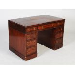 A 19th century mahogany pedestal desk, the rectangular top with claret coloured skiver above a
