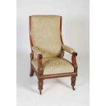 A William IV mahogany armchair, the later floral upholstered back, arms and seat raised on foliate