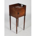 An early 19th century mahogany bedside locker/ pot cupboard, the rectangular top with three-