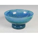A Monart bowl, shape GB, mottled blue and green glass with three pulled up lines, 11cm high x 21cm