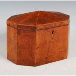 A George III burr walnut and boxwood lined octagonal shaped tea caddy, the hinged cover opening to a
