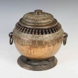 A Chinese bronze twin handled censer and cover, Qing Dynasty, the oviform body with pierced double