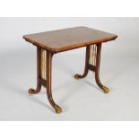 A 19th century rosewood and parcel gilt reading table, the rectangular top with re-entrant corners